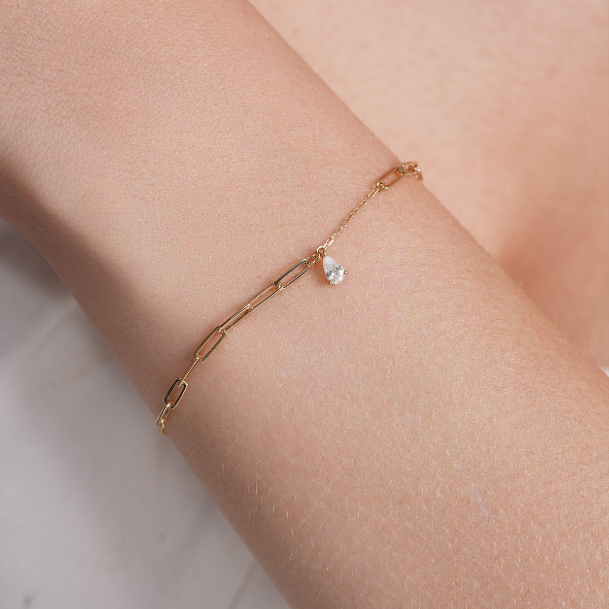 14KB0007. - 14 Karat Yellow Gold Teardrop CZ Charm Paperclip Adjustable Bracelet