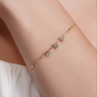 14KB0012. - 14 Karat Yellow Gold Three Diamond Cut Heart Charm Adjustable Bracelet