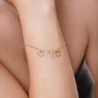 14KB0017. - 14 Karat Yellow Gold Three Diamond Cut Butterfly Adjustable Bracelet