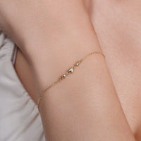 14KB0018. - 14 Karat Yellow Gold Three Hearts Charm Adjustable Bracelet